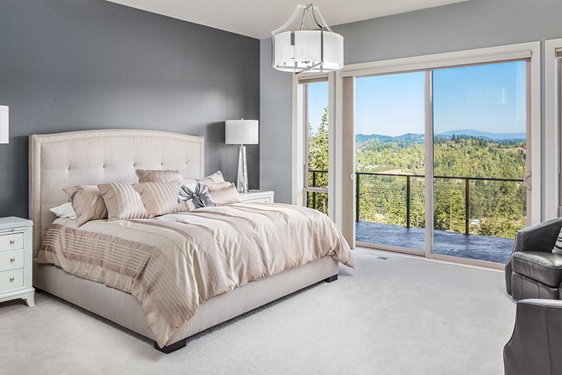 Interior view of a spacious condo with a nice view from the balcony.