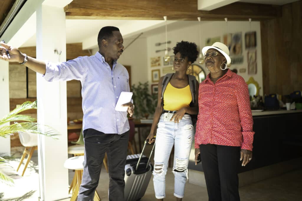 Elderly woman tour home in a 55+community with her granddaughter.