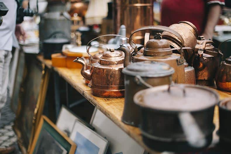 Antique pans and pots at an estate sale.