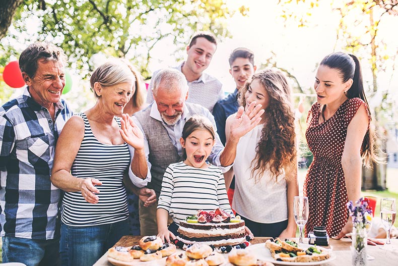 A family celebration outside in the backyard.