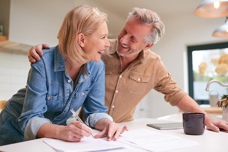 A happy 55+ couple receiving a break on their taxes.