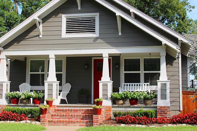 Exterior view of a single-family home with an attractive front porch.