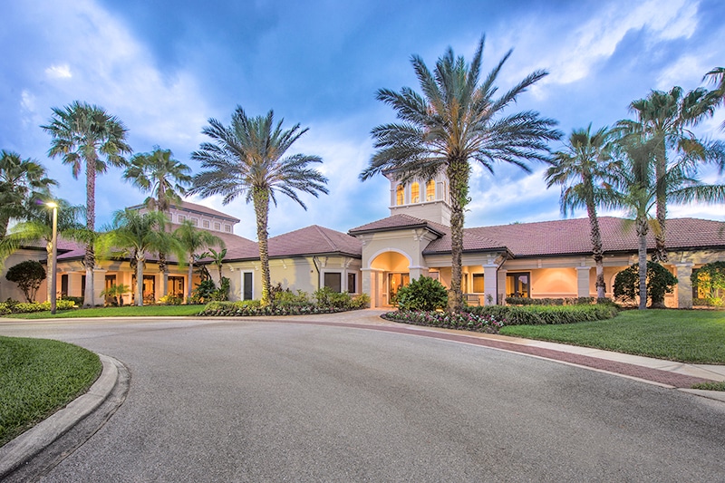 Palm trees surrounding the clubhouse at Cypress Falls at The Woodlands in North Port, Florida.