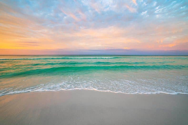 View of the beach in Destin, Florida during a morning sunrise.