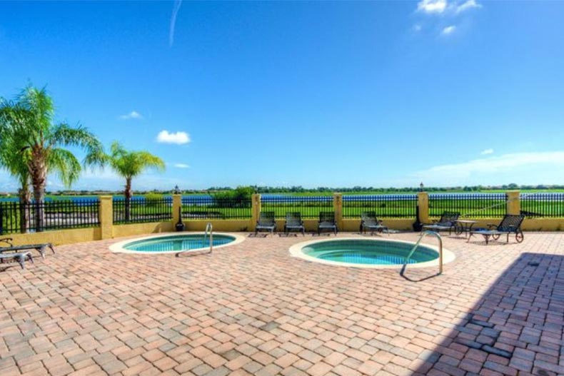 Lounge chairs beside the outdoor whirlpool spas at Lake Ashton in Lake Wales, Florida.