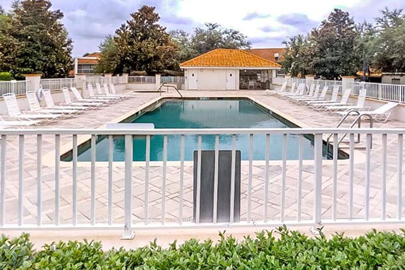 Lounge chairs beside the outdoor pool at Lakeside Landings in Oxford, Florida.