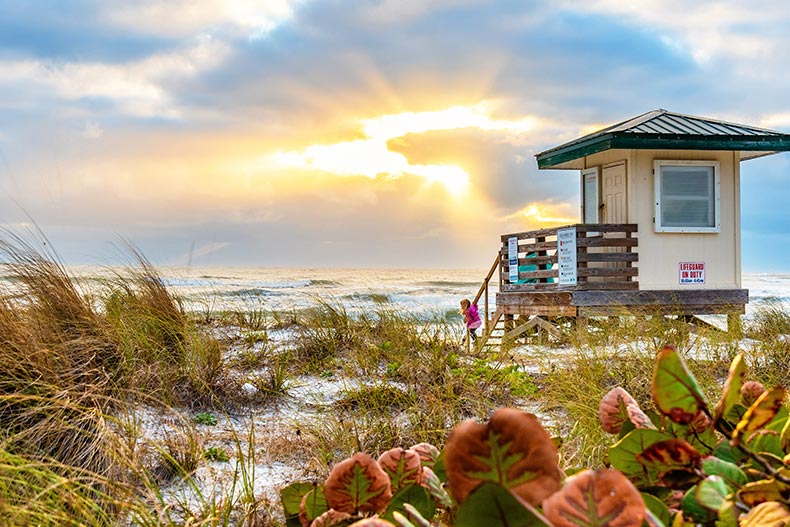 The Lido Key Beach lifeguard tower at sunset in Sarasota, Florida.