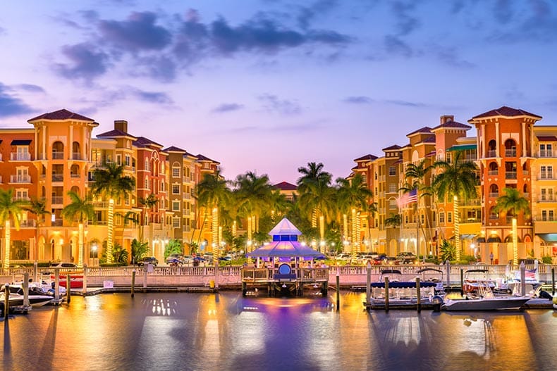 The downtown skyline of Naples, Florida at dusk.