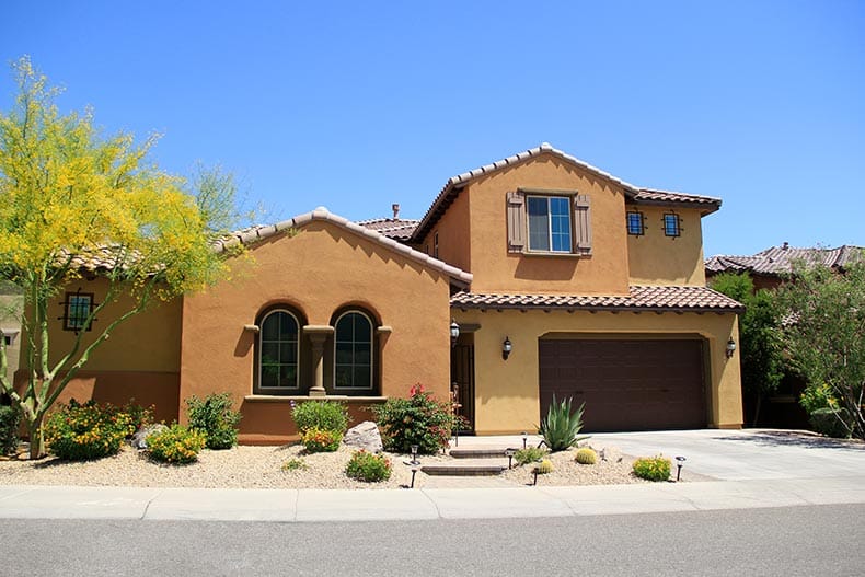 Exterior view of a two-story, new-construction home in a southwest style.