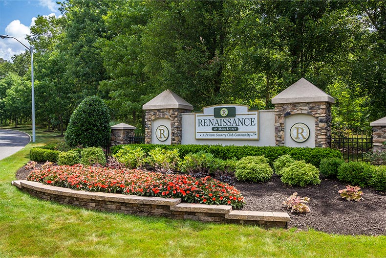 Greenery surrounding the community sign for