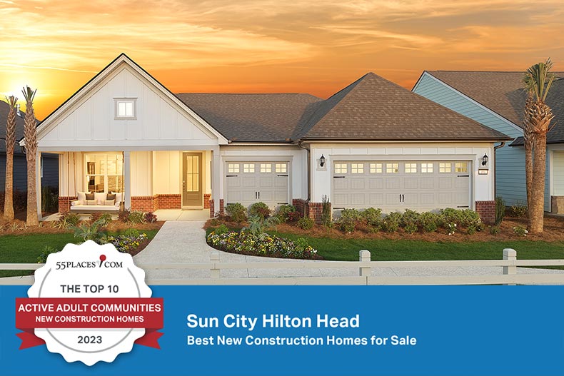 Exterior view of a model home at Sun City Hilton Head in Bluffton, SC and a "New Construction" award banner.