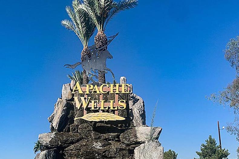 The community sign fro Apache Wells in Mesa, Arizona.