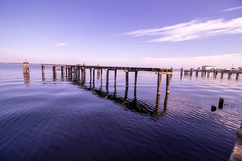A closeup of a boardwalk on the water in Sanford, Florida.