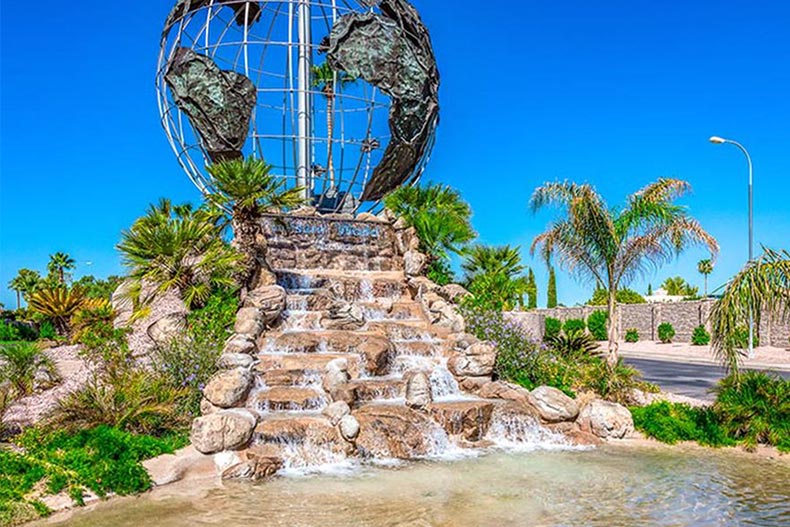 A metal globe on top of a fountain at Leisure World in Mesa, Arizona.