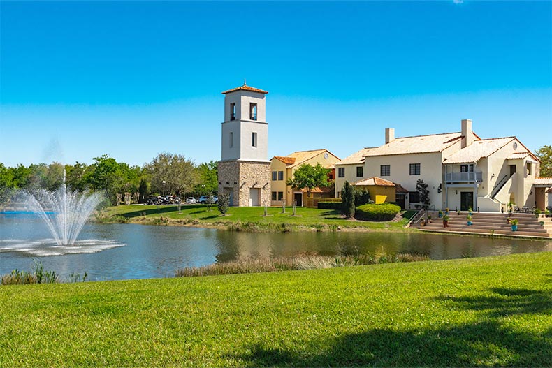 A scenic pond beside community buildings on the grounds of Solivita in Kissimmee, Florida.