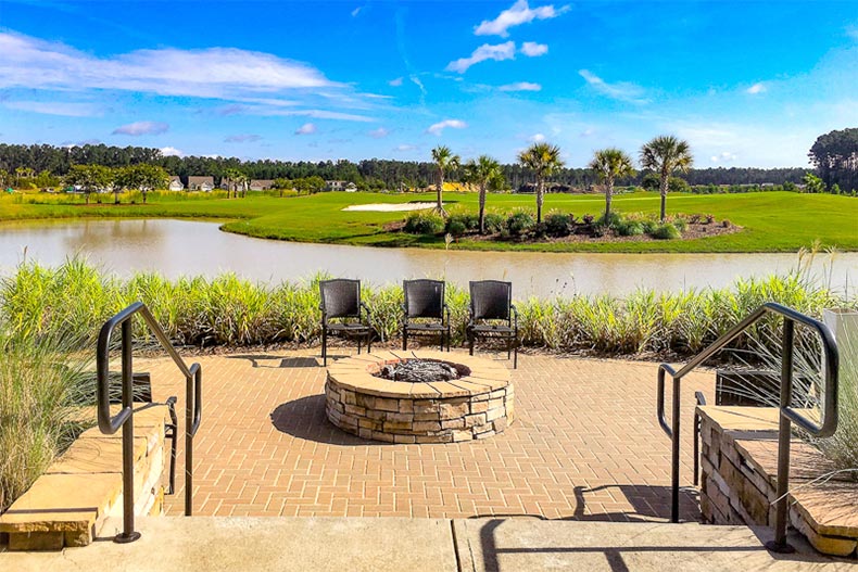 Chairs surrounding an outdoor fire pit on the grounds of Sun City Hilton Head in Bluffton, South Carolina.