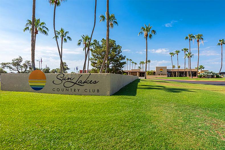 Palm trees beside the community sign at Sun Lakes in Sun Lakes, Arizona.