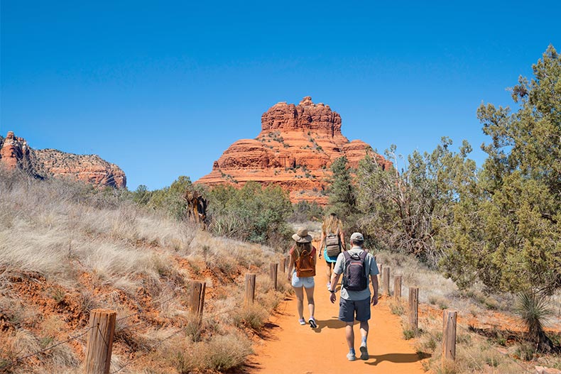 Family hiking on Bell Rock Loop just north of Oak Creek, Arizona.