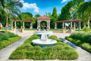 Lush greenery surrounding a fountain at a public park in Lakeland, Florida.