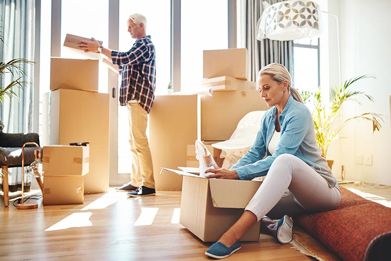 A 55+ couple packing boxes and downsizing their house.