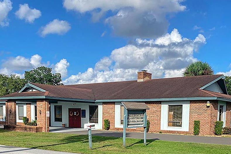 Exterior view of a community building on the grounds of Pine Run Estates in Ocala, Florida.