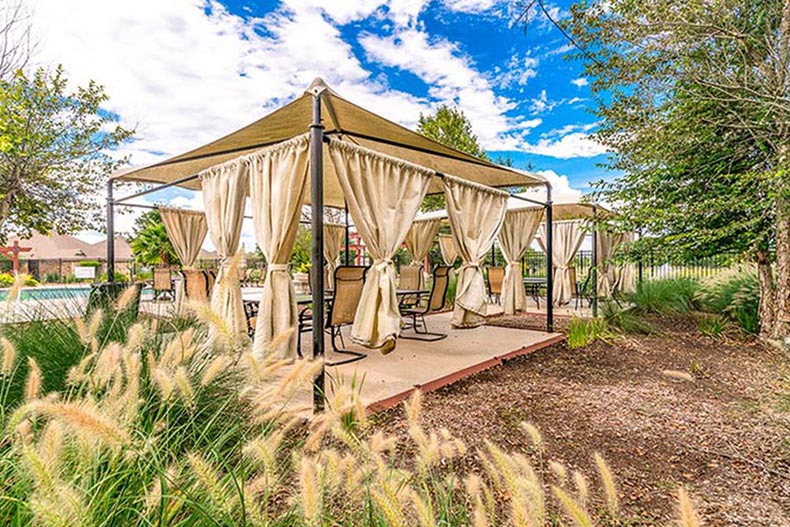 A lounge area beside the pool at The Village at Tuscan Lakes in League City, Texas.