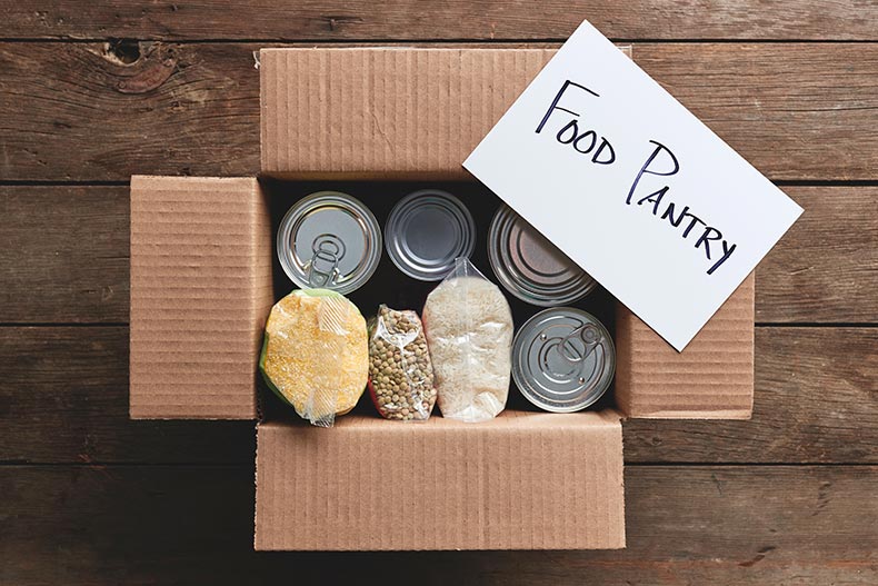 A box full of food items for a food pantry delivery.