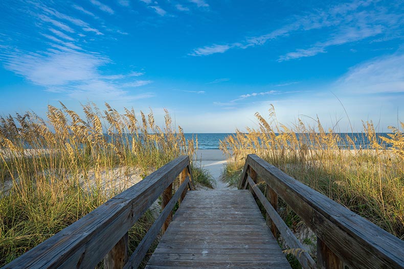 Pathway to the beach between sand dunes in Jacksonville, Florida.