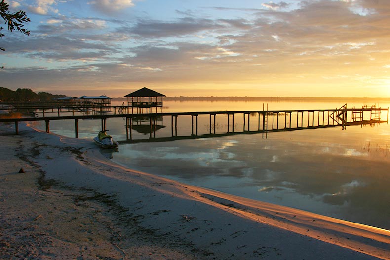 A boat pier at sunrise in Lake Placid, Florida.