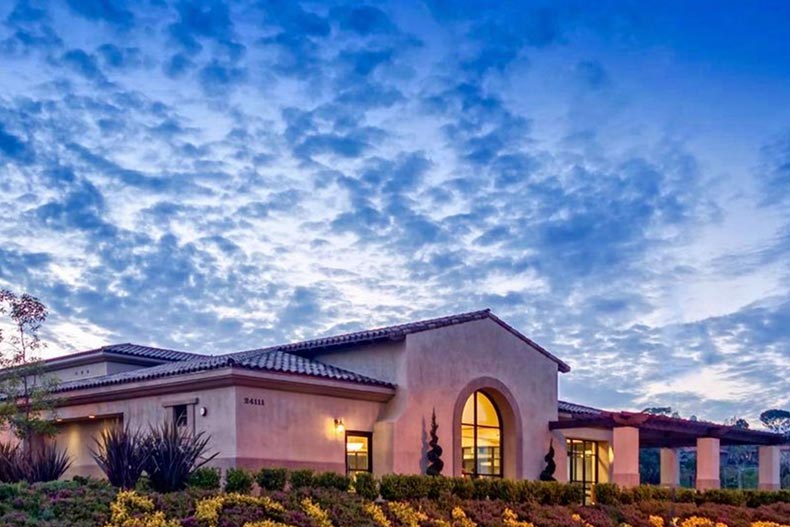 Exterior view of the clubhouse at Laguna Woods Village in Laguna Woods, California at night.