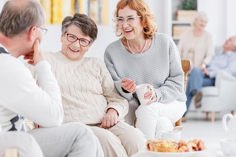 A group of 55+ neighbors talking and enjoying each other's company.