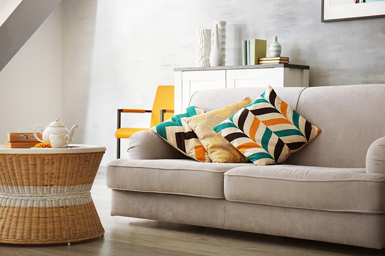 A modern living room with a sofa and other furniture.