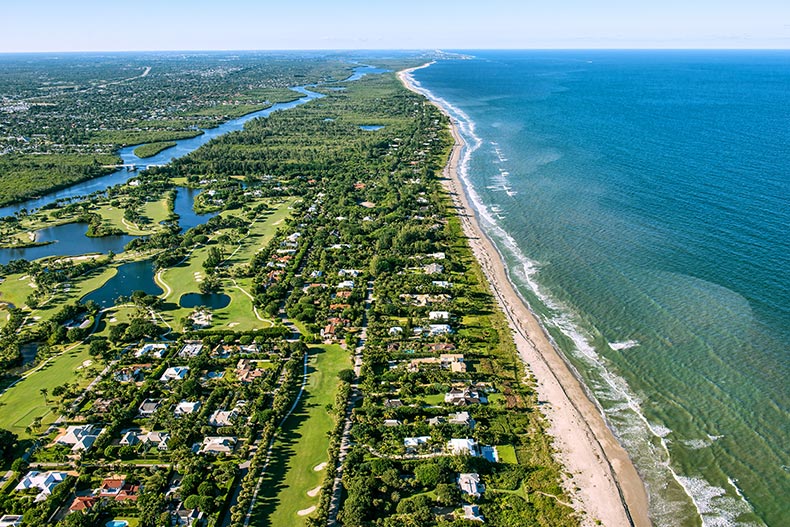 Aerial view of Hobe Sound, Florida dotted by luxury homes and golf courses.