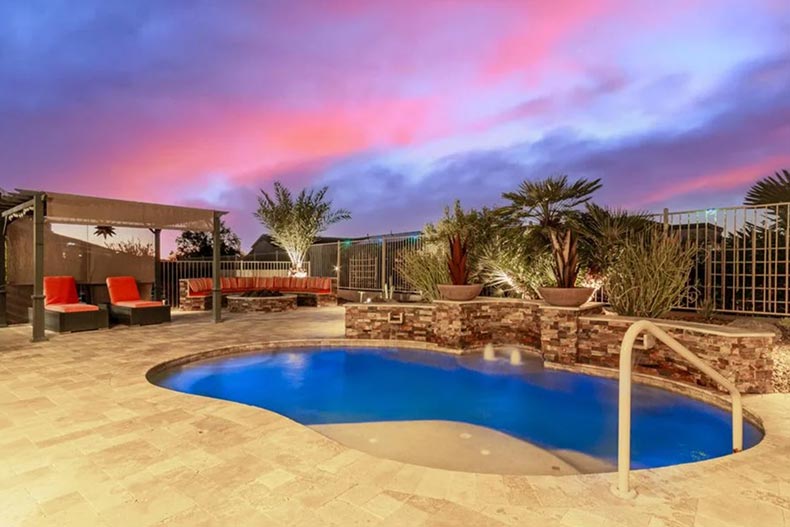 An outdoor pool at a home at CantaMia at Estrella in Goodyear, Arizona.