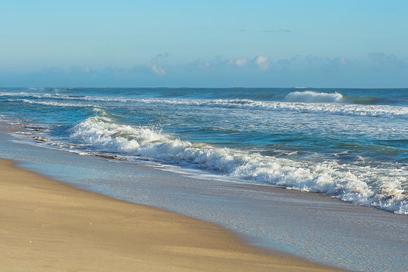 A Florida beach with rough surf.