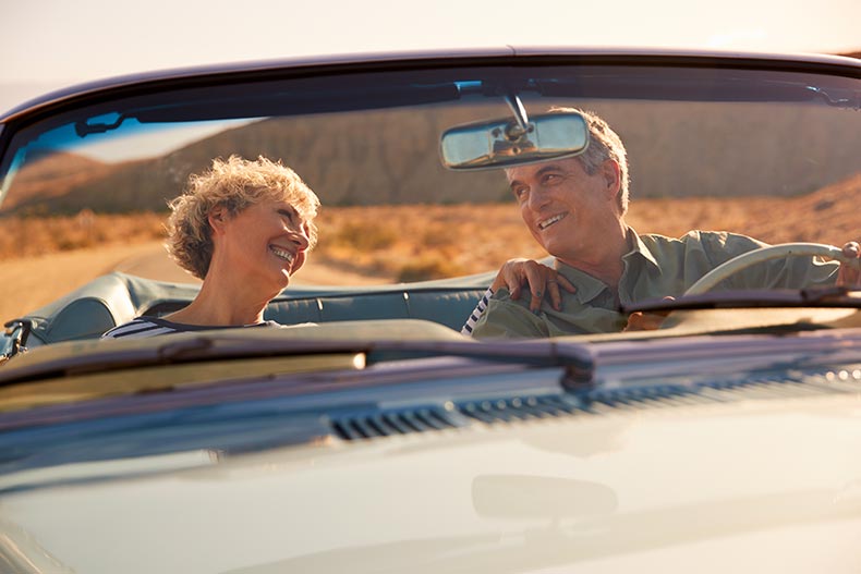 A senior couple on a road trip through the desert.