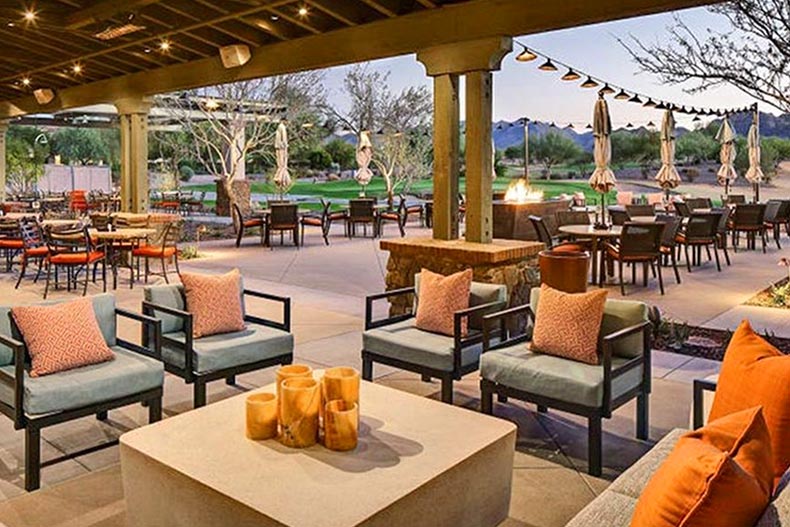 Lounge chairs and tables on the outdoor patio at Sun City Festival in Buckeye, Arizona.