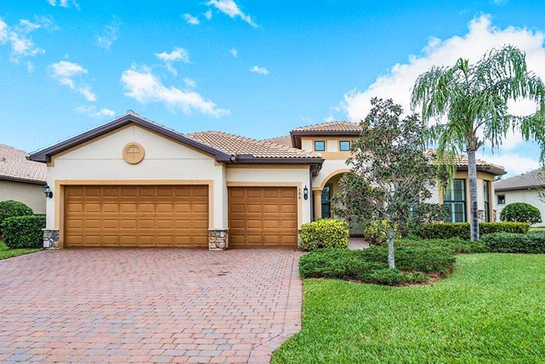 Exterior view of a model home at Veranda Gardens, a community on the Treasure Coast of Florida with homes for sale.