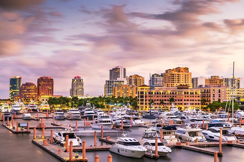 The downtown skyline on the Intracoastal Waterway at dusk in West Palm Beach, Florida.