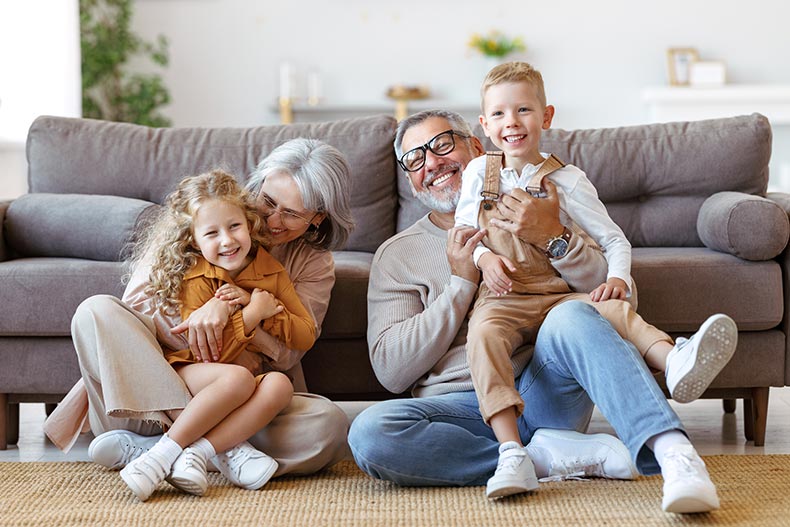 Retired grandparents and two cute little kids in a new home bought in 2024.