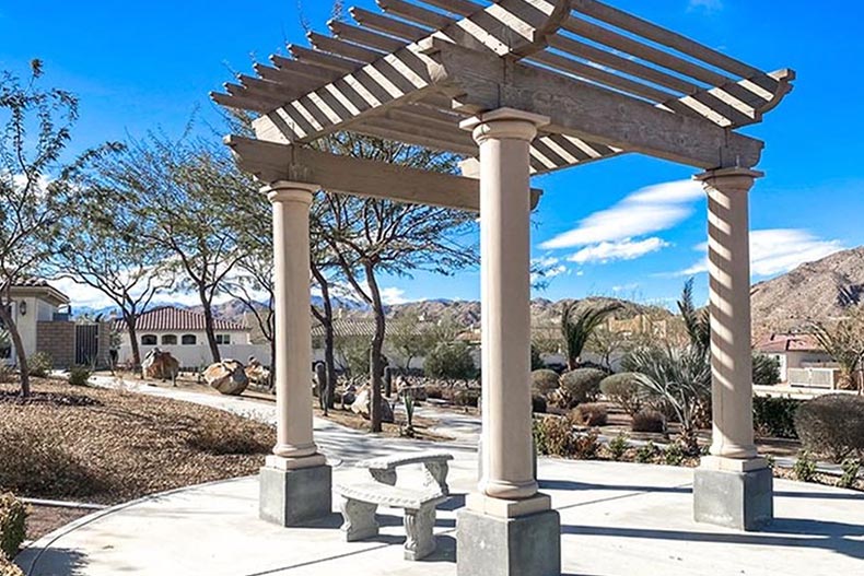 Walking paths and benches on the grounds of Desert Vista Village in Yucca Valley, California.