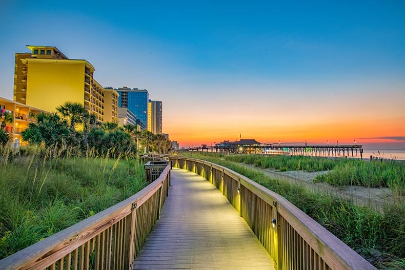 A boardwalk in Myrtle Beach, South Carolina at sunrise.