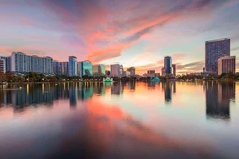 View of the Downtown Orlando skyline from Eola Park at dusk.