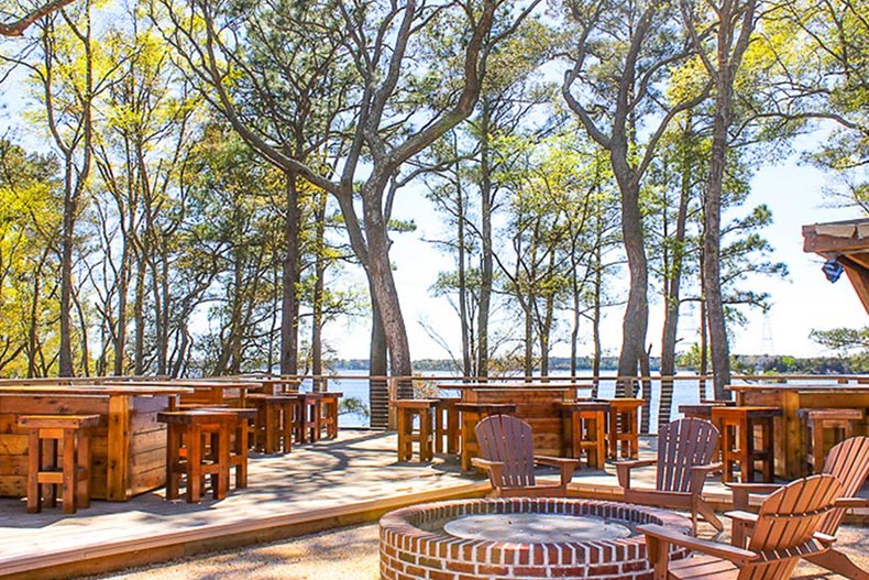 The outdoor patio beside the water at Del Webb Wilmington.