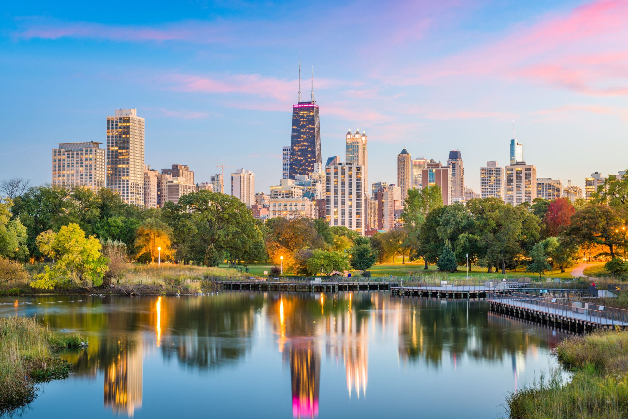 View across the water of the Chicago, Illinois skyline at sunset.