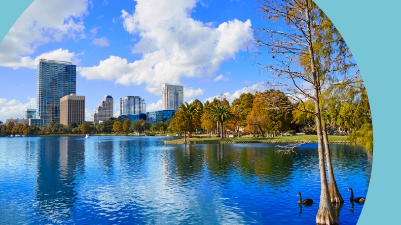 View of the Orlando skyline from across Lake Eola on a sunny day.