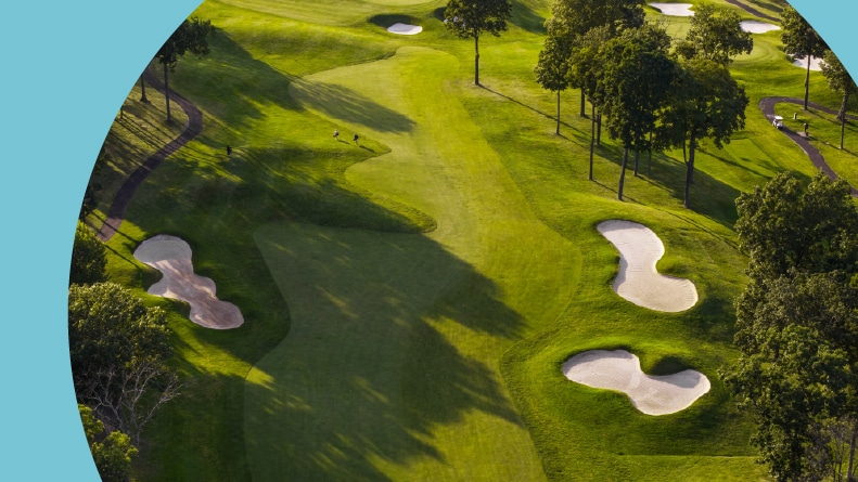 Aerial view of a golf course in summertime.