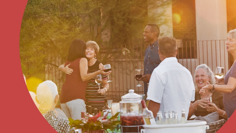 Neighbors having an outdoor party in a 55+ community.