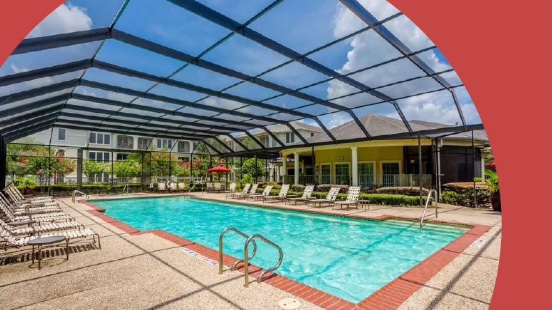 Lounge chairs beside the pool at Arella Forest at Woodland in Conroe, Texas.