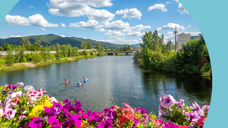 A group of kayakers enjoying a summer day on Sand Creek River and Lake Pend Oreille in Sandpoint, Idaho.